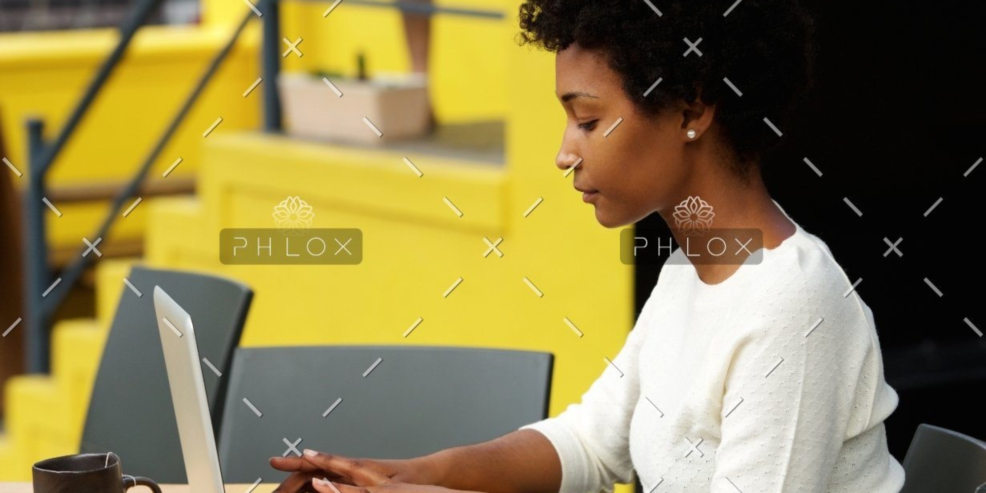 demo-attachment-1082-attractive-young-woman-using-laptop-outside-P9RLFGU@2x